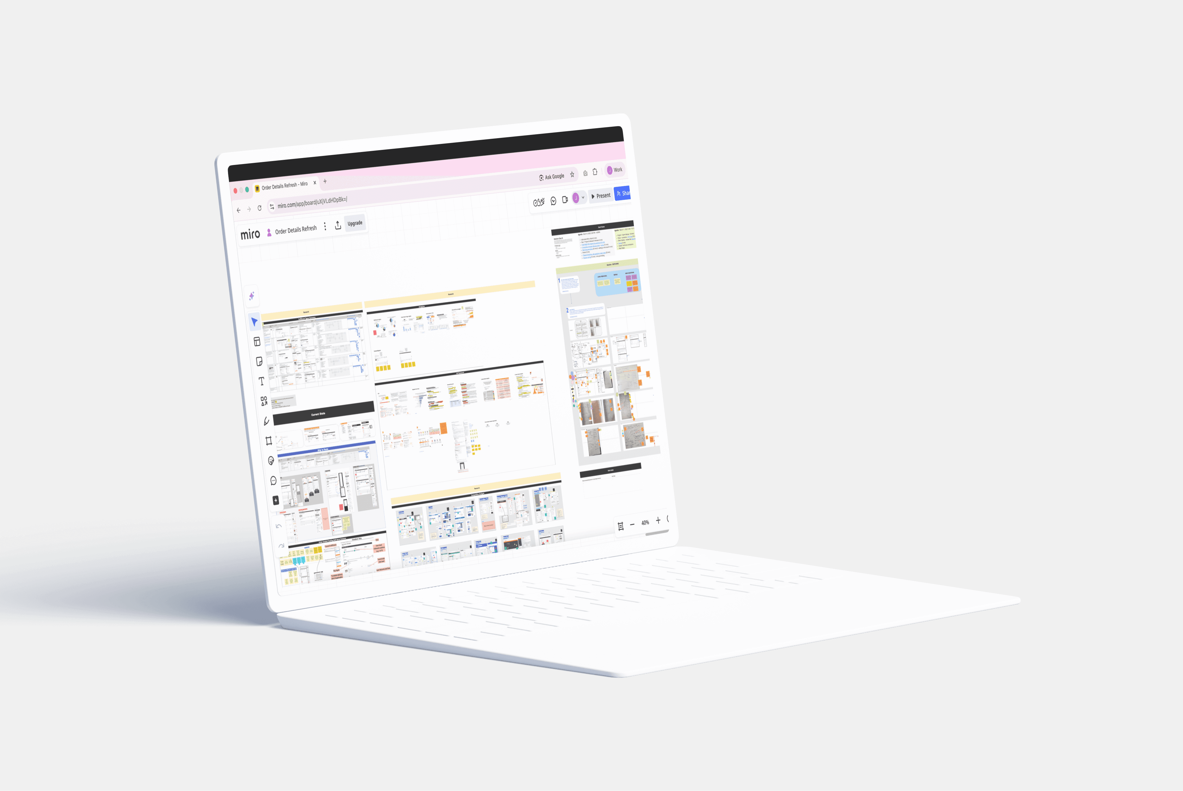 Mockup of a Miro board with design sprint activities on a clay laptop