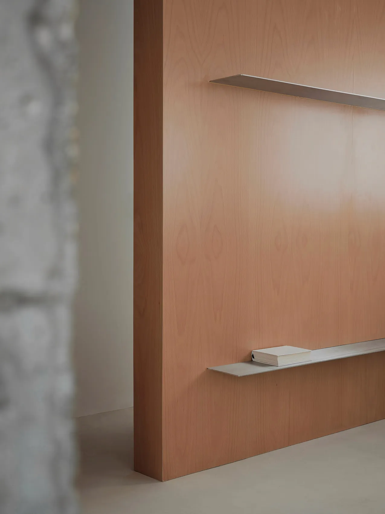 Wooden interior detail with floating shelf