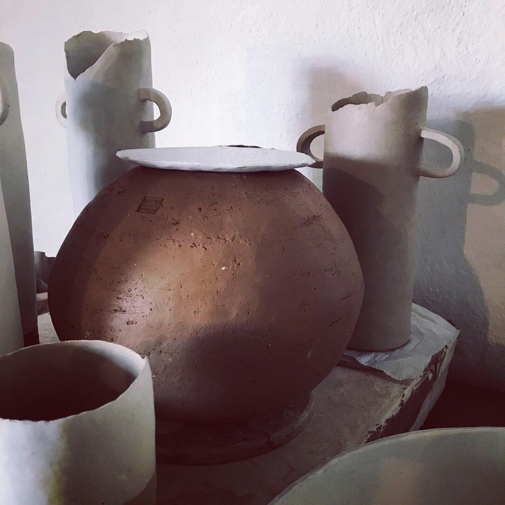 Two people stretching on yoga mats