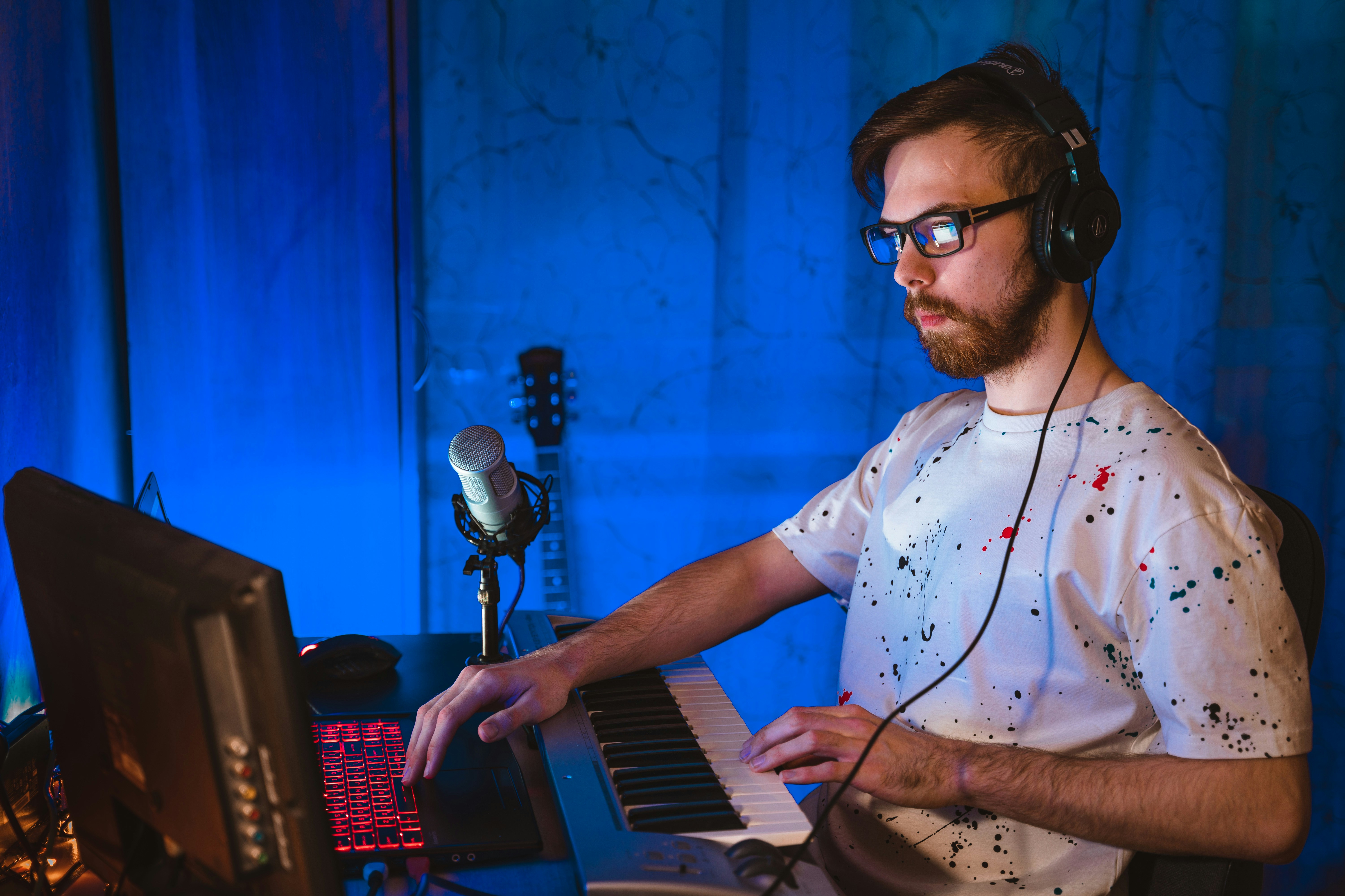 man sitting infront of keyboard - How To Make Good Music 