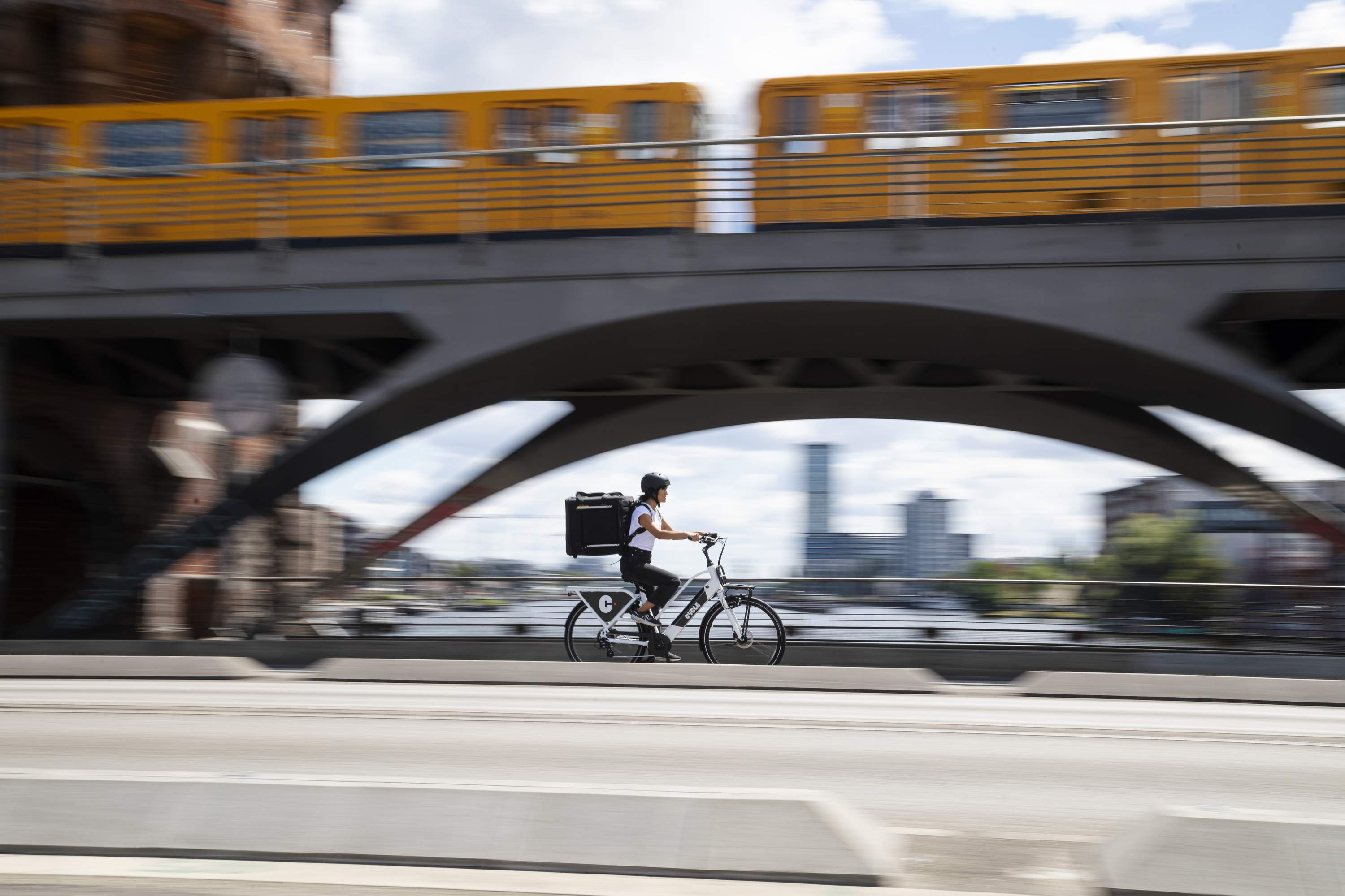 Woman delivering on a Cycle e-bike in the city