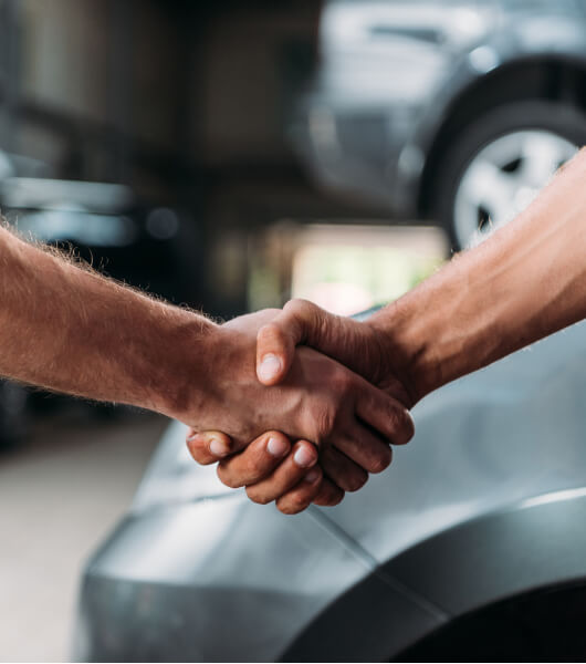 person sitting in a chair in front of a man