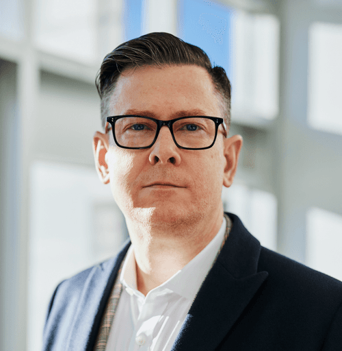 man standing beside wall