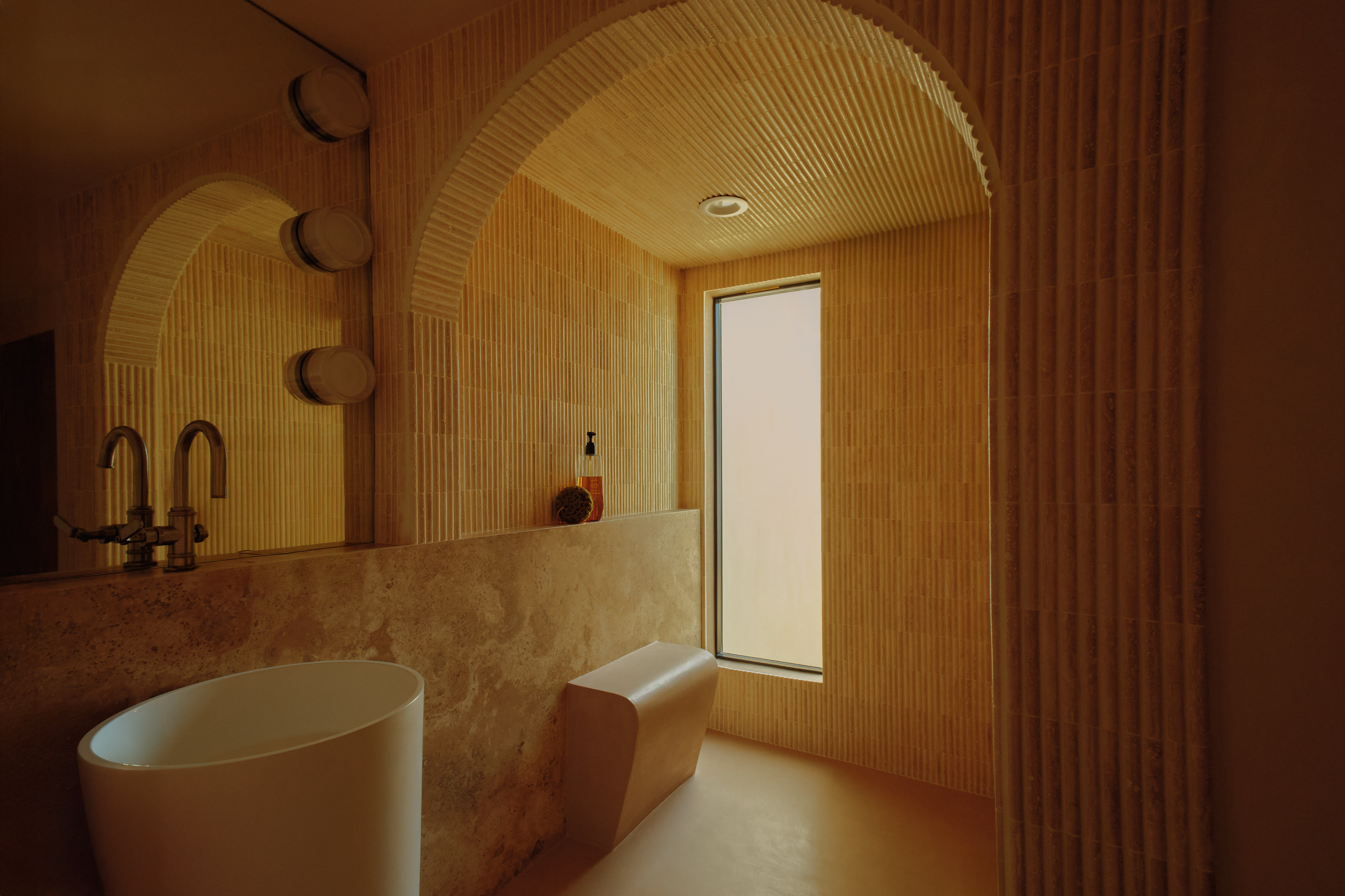 Athletes resting on a blue running track.