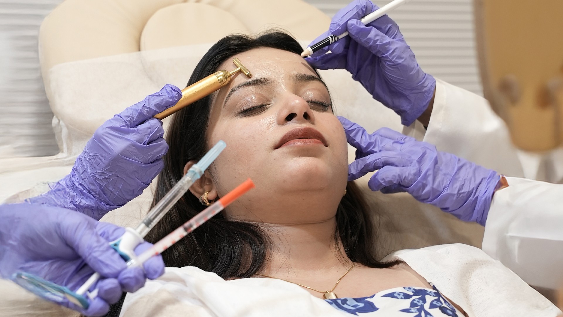 Portrait of a woman with long red hair and closed eyes, gently touching her face with both hands