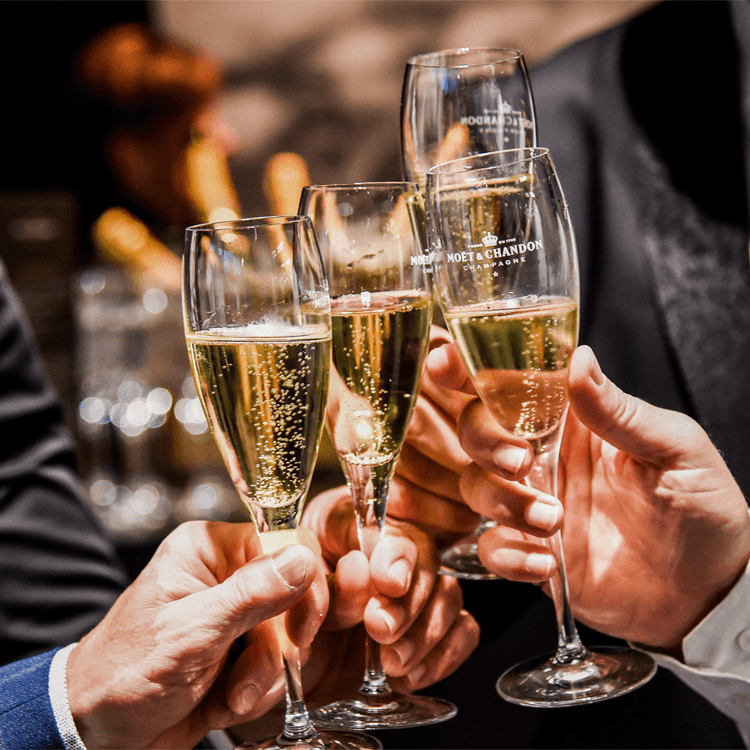 A woman in a straw hat stands in the grass
