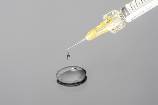Croma Saypha syringe with clear gel droplet above reflective surface – Canada