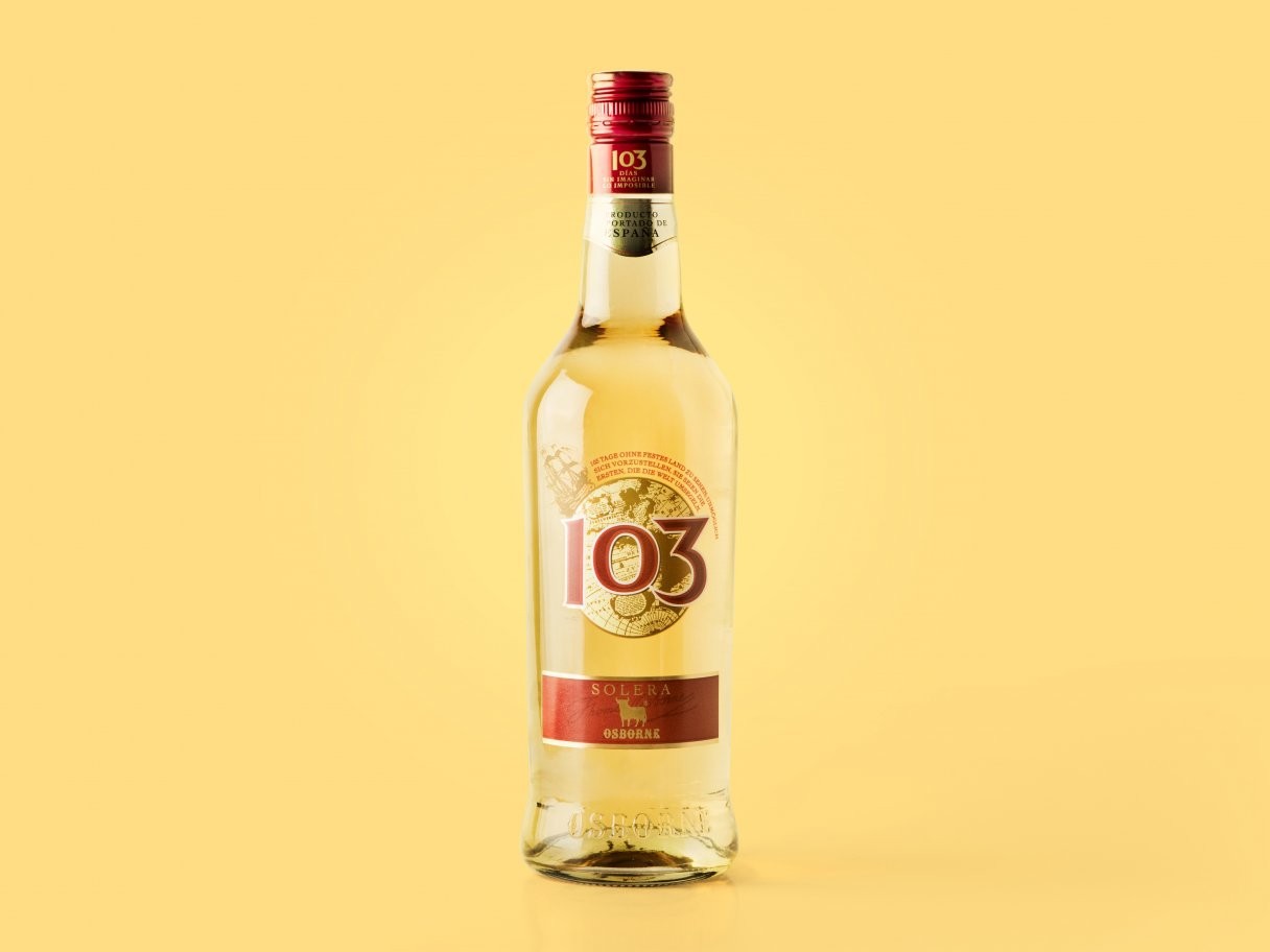 Rustic cabin in a golden field at sunset