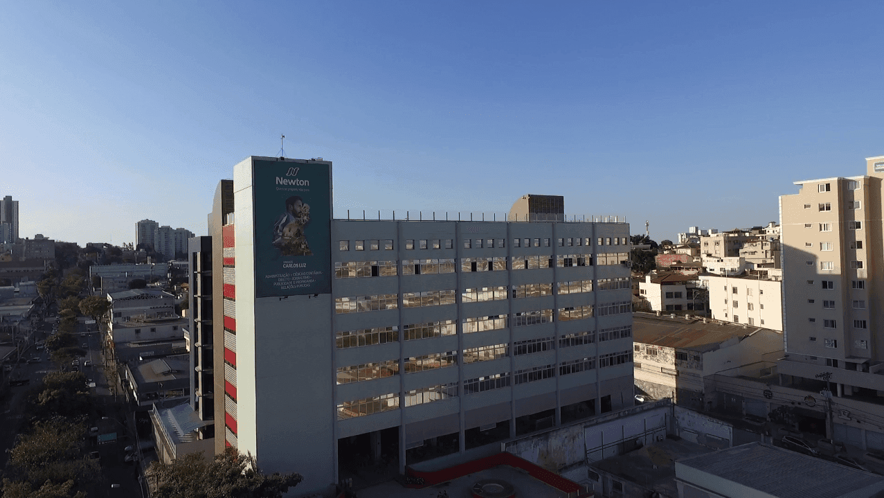 Three friends talking outdoors on a sunny day.