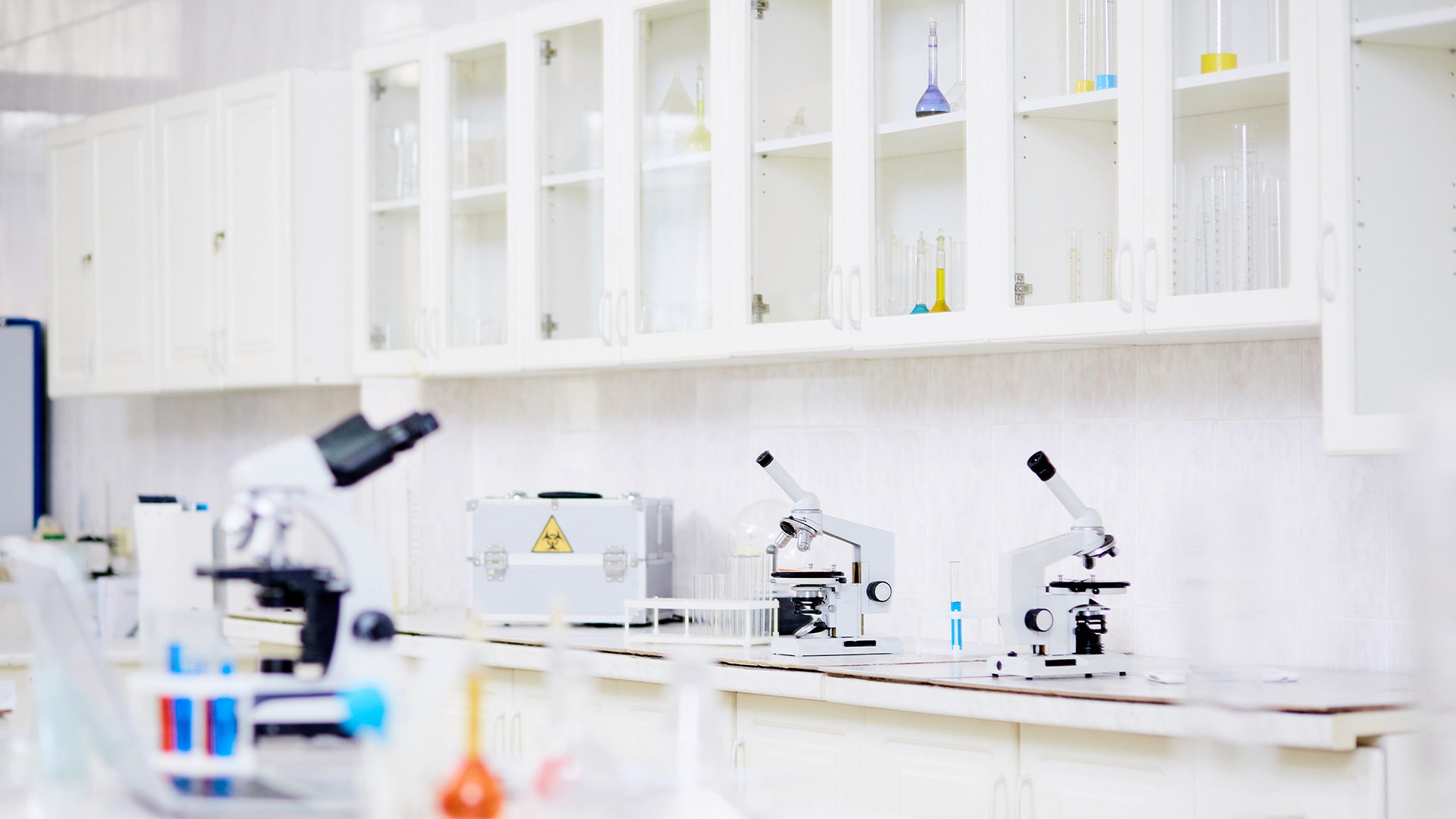 Science lab with microscopes in a clean and organized environment.