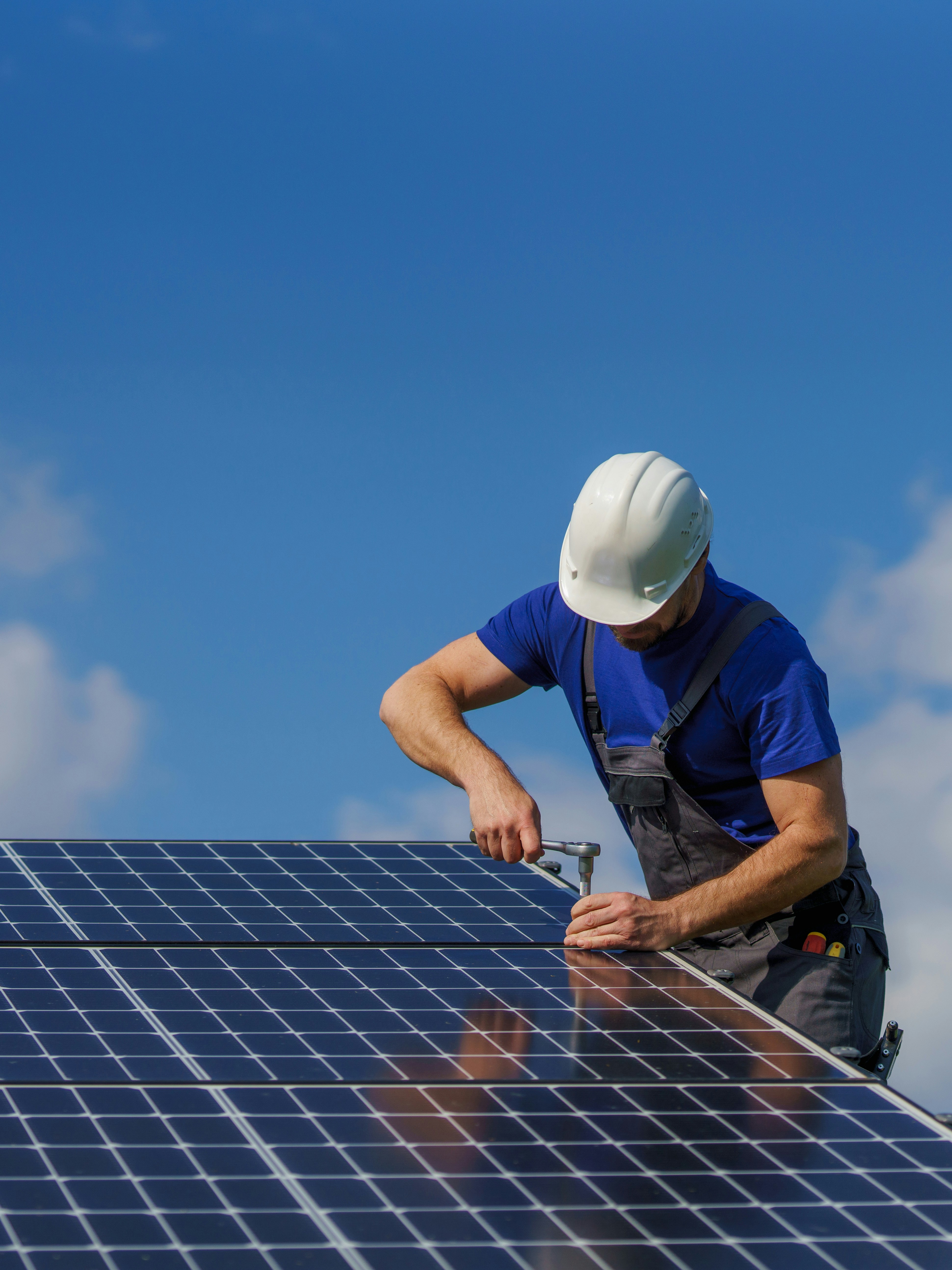 Solar panel installation Technician using level tool