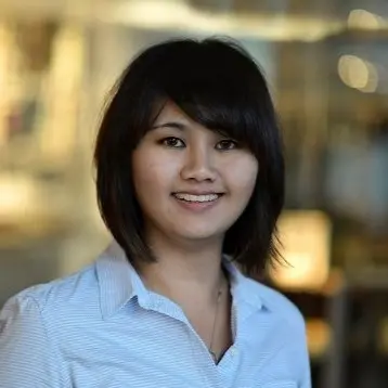 Smiling young woman in light blue shirt.