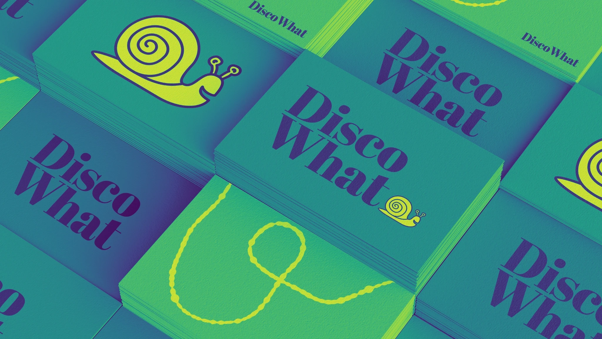 Stacks of business cards with Disco What logos printed on them.