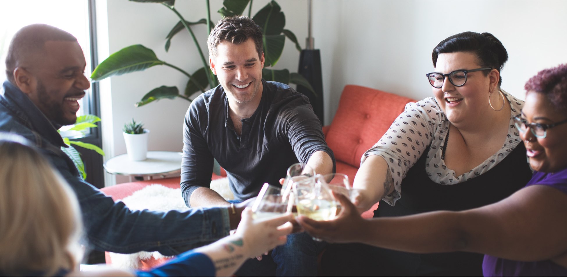 People having fun at a party, some holding tools.