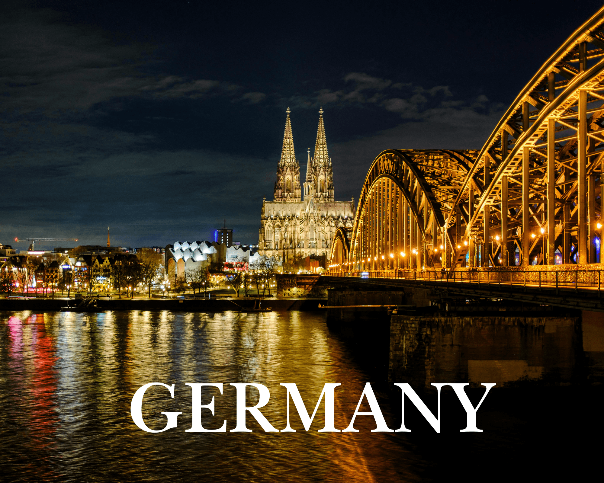 person in orange jacket standing on brown rock near snow covered mountain during daytime
