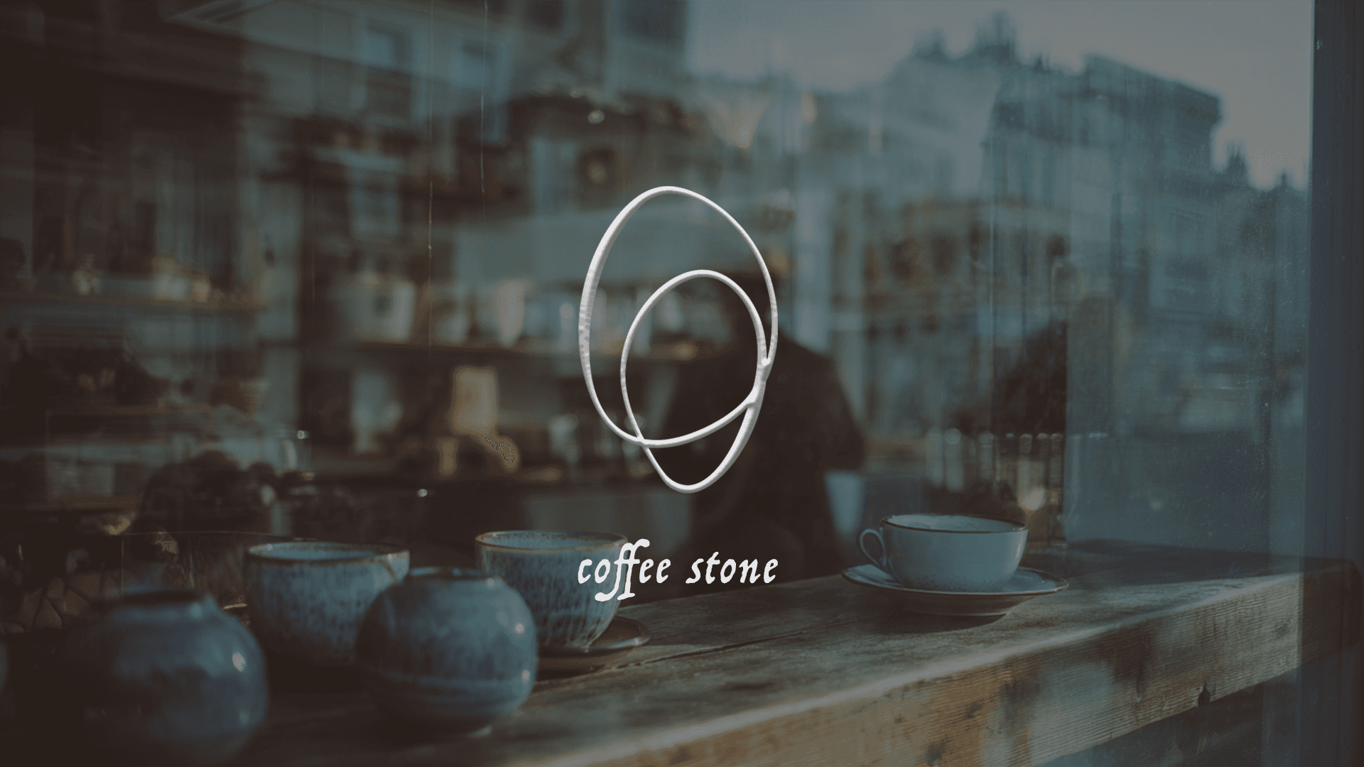 Silhouette of a person's face behind a wet surface.