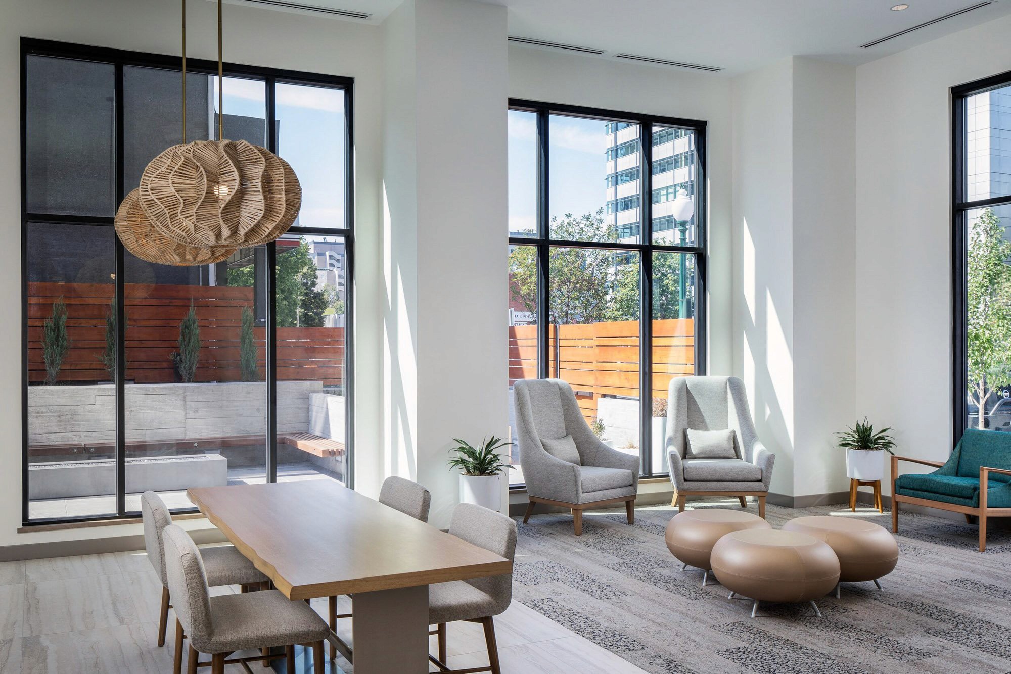 Modern lounge with dining table and seating area.