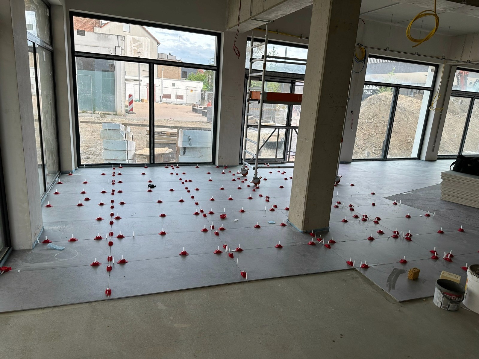 woman sitting around table holding tablet