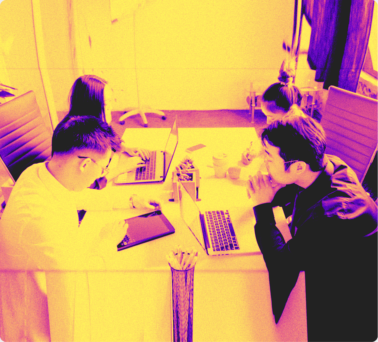 Stylized photo of founders meeting brainstorm