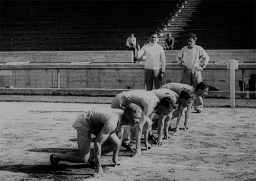 Gif of a vintage looking scene from a movie with a race
