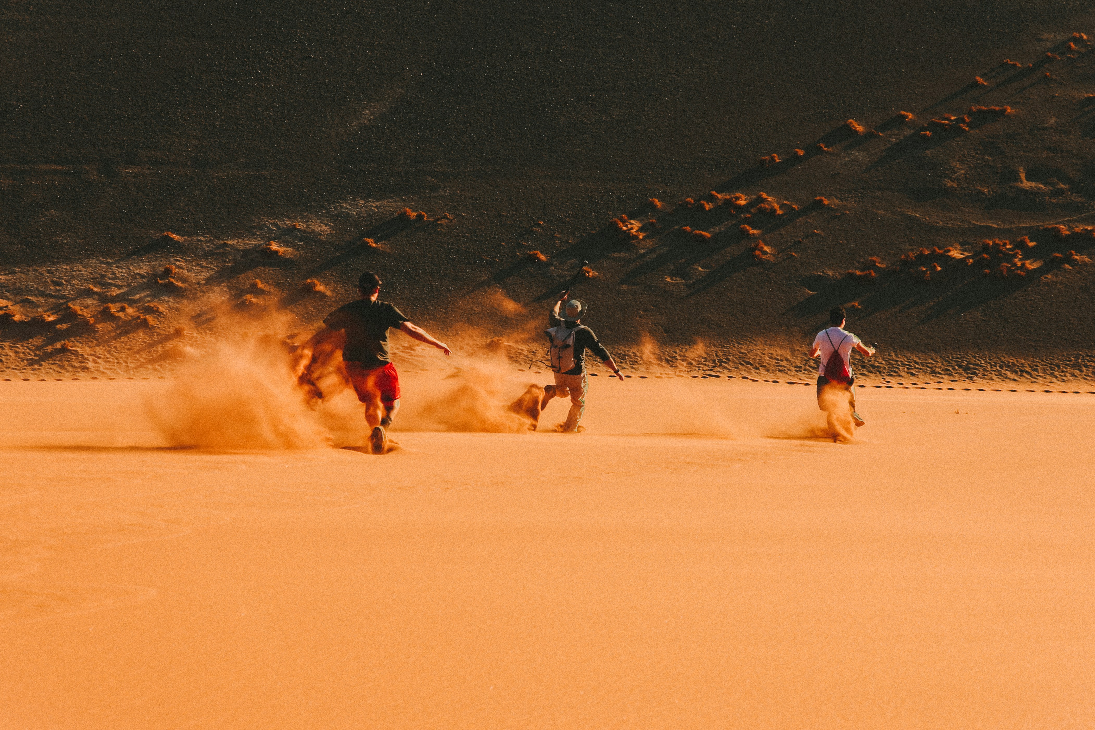 Dynamic Shot Of Running Down Namibian Dunes