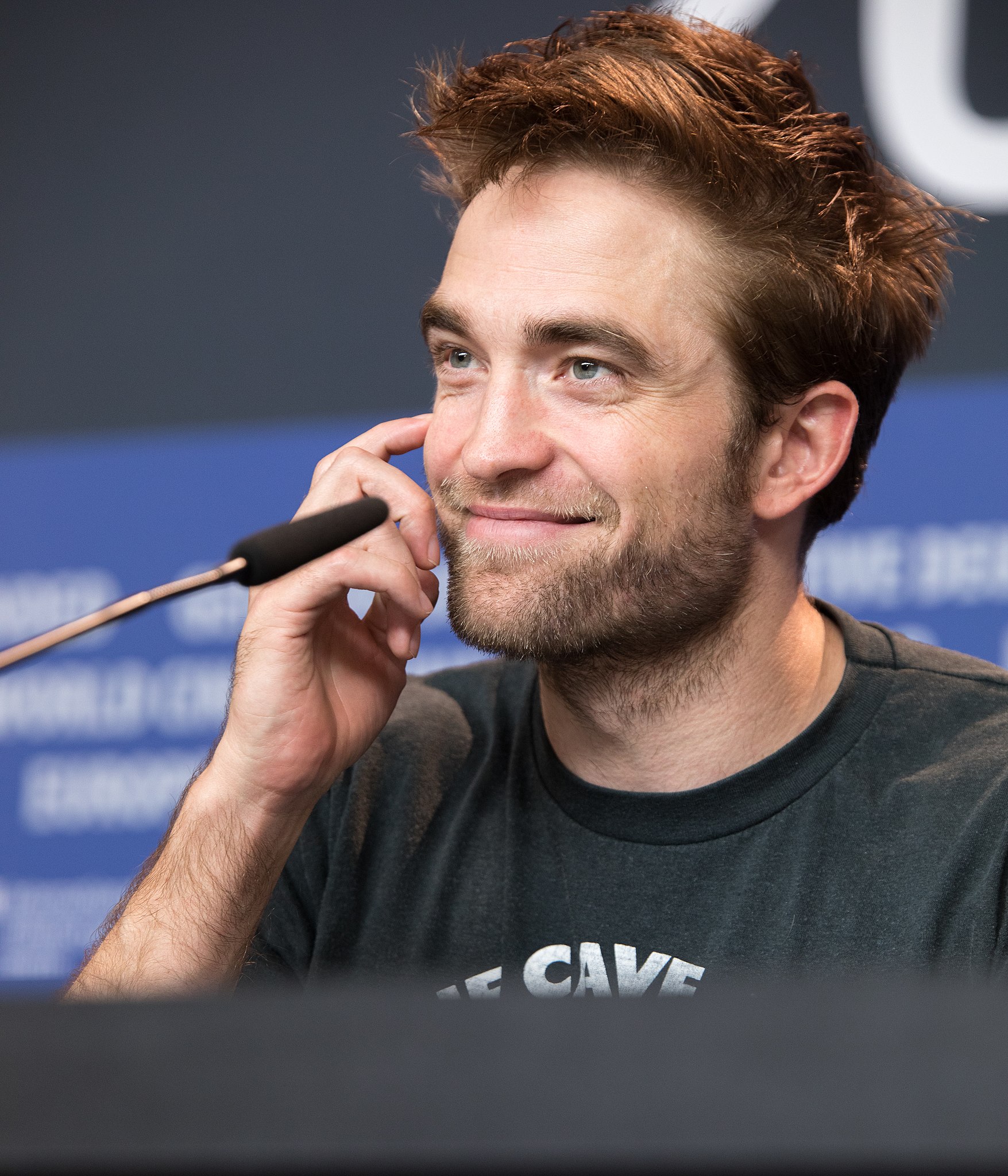 Portrait image of Robert Pattinson conducting an interview