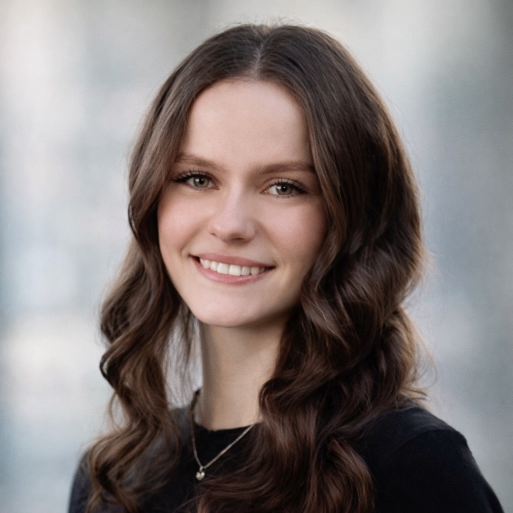 a woman with long blonde hair wearing a black shirt