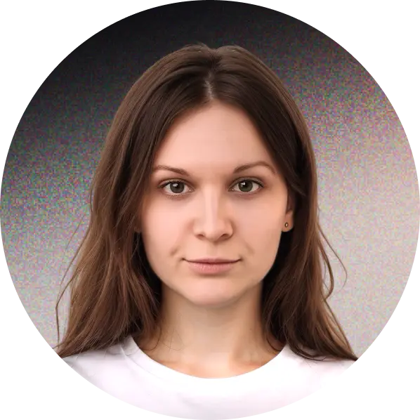 Profile portrait of a man in a white shirt against a light background