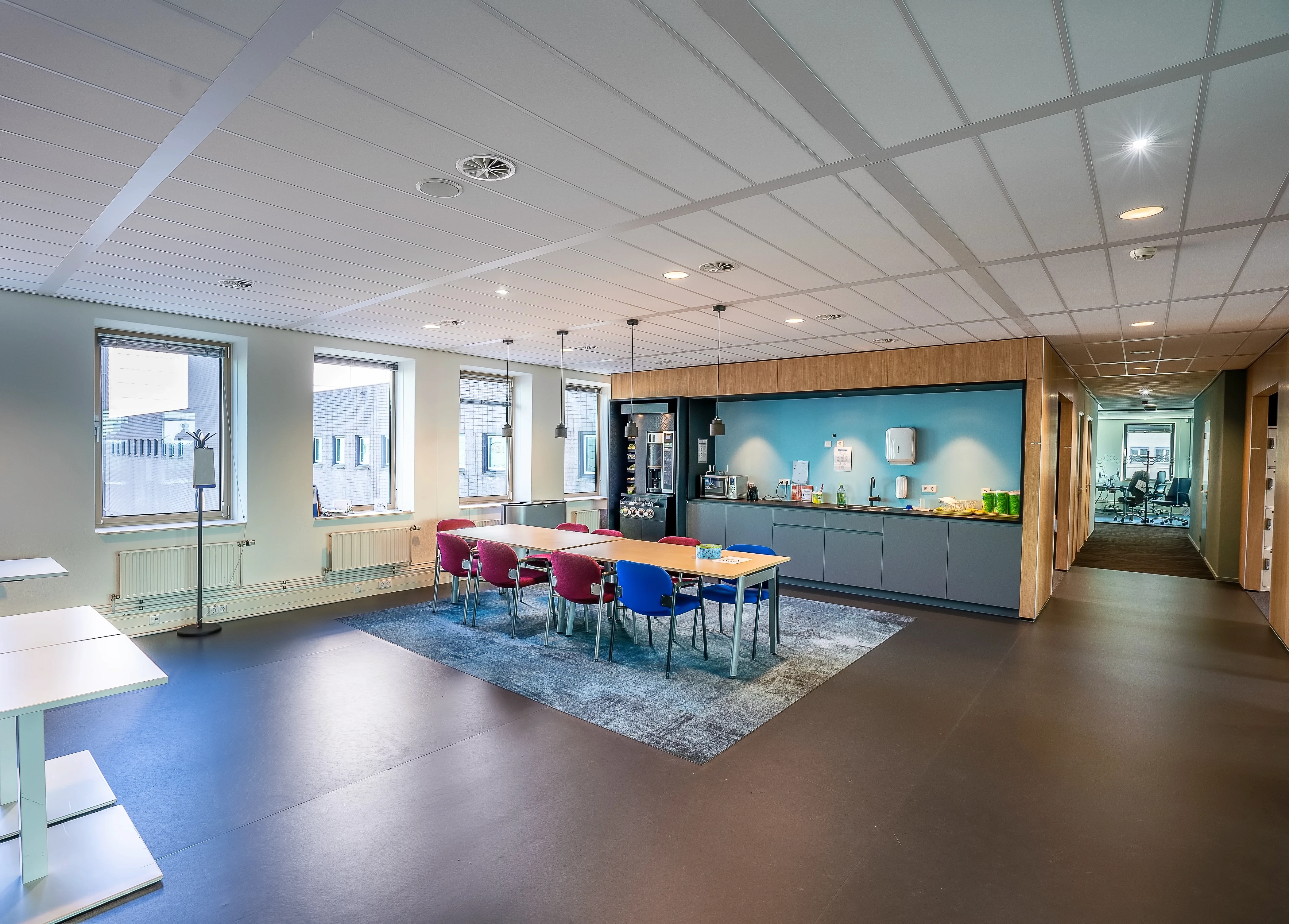 interior-kitchen-area-modern-office-with-long-wooden-table-chairs