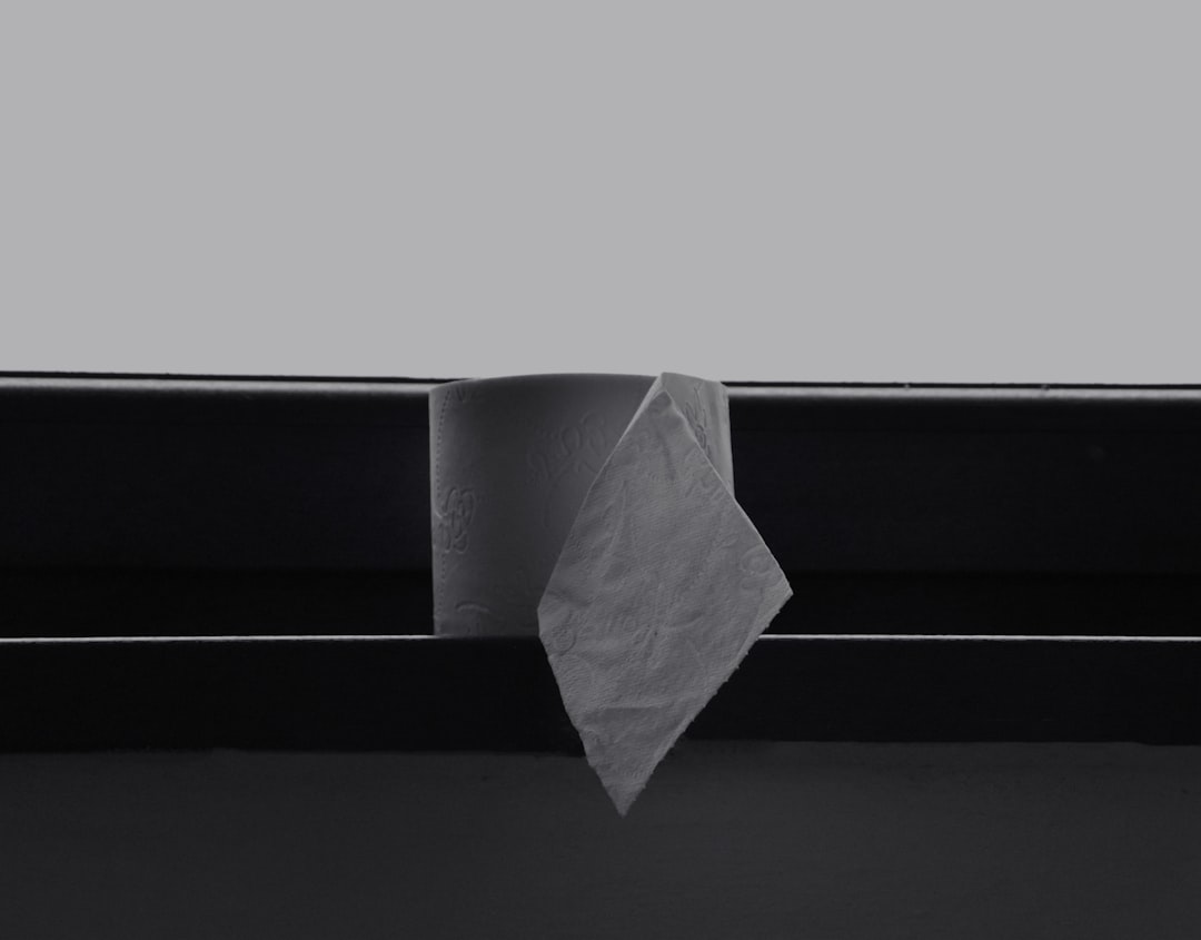 white paper on black surface