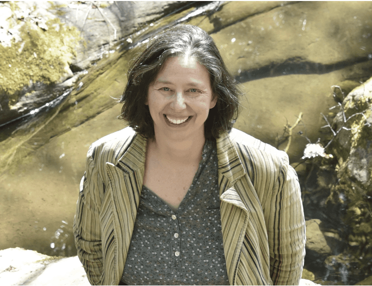 Woman with freckles and curly dark hair