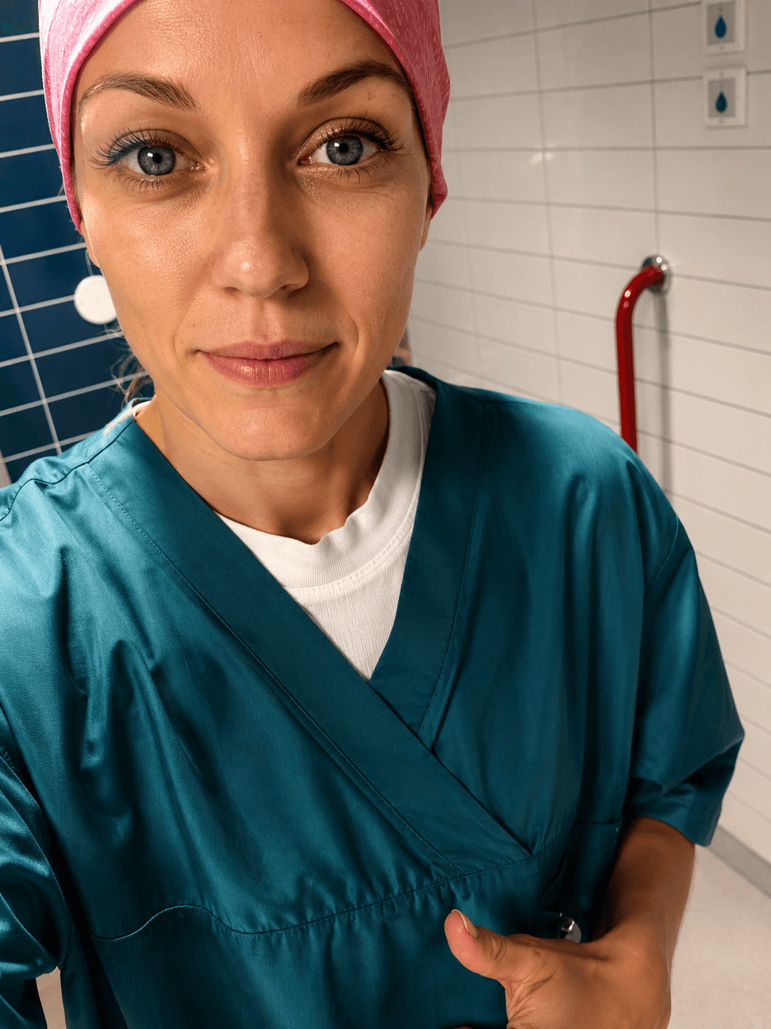 Elina in medical scrubs