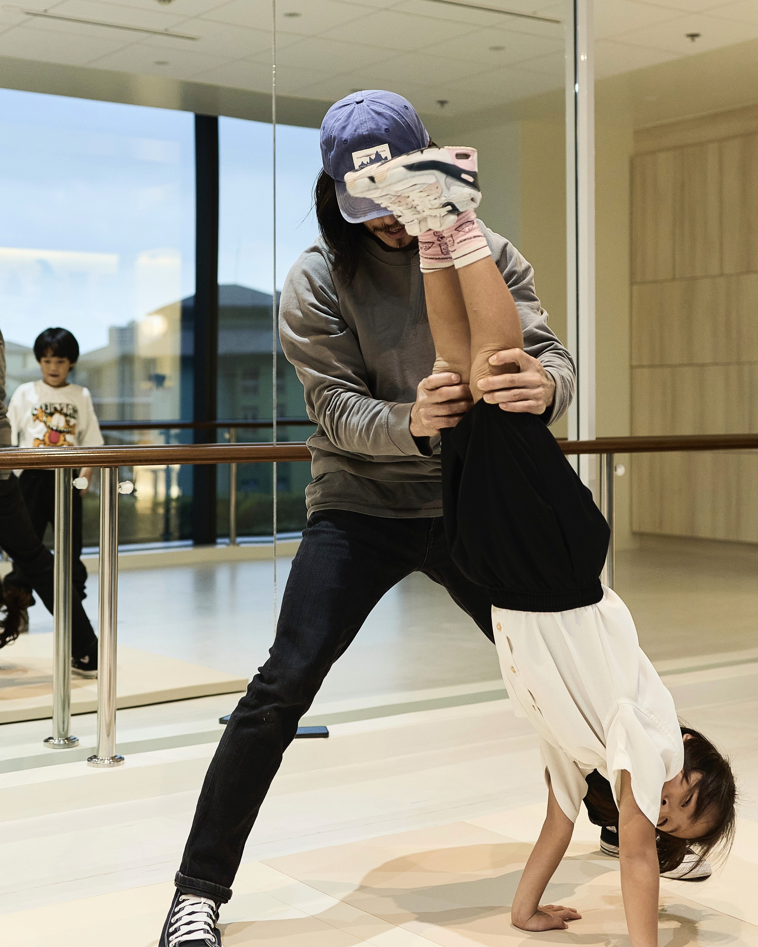 teacher teaching kid breakdancing in BGC Taguig