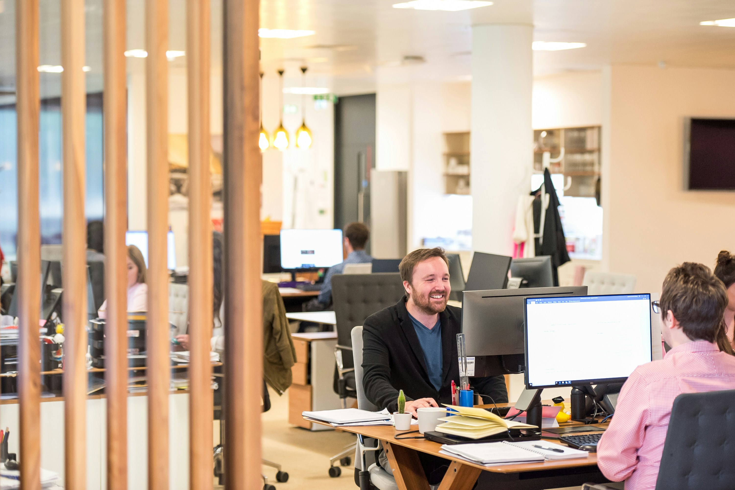 man in office happily using ChatGPT prompts for business