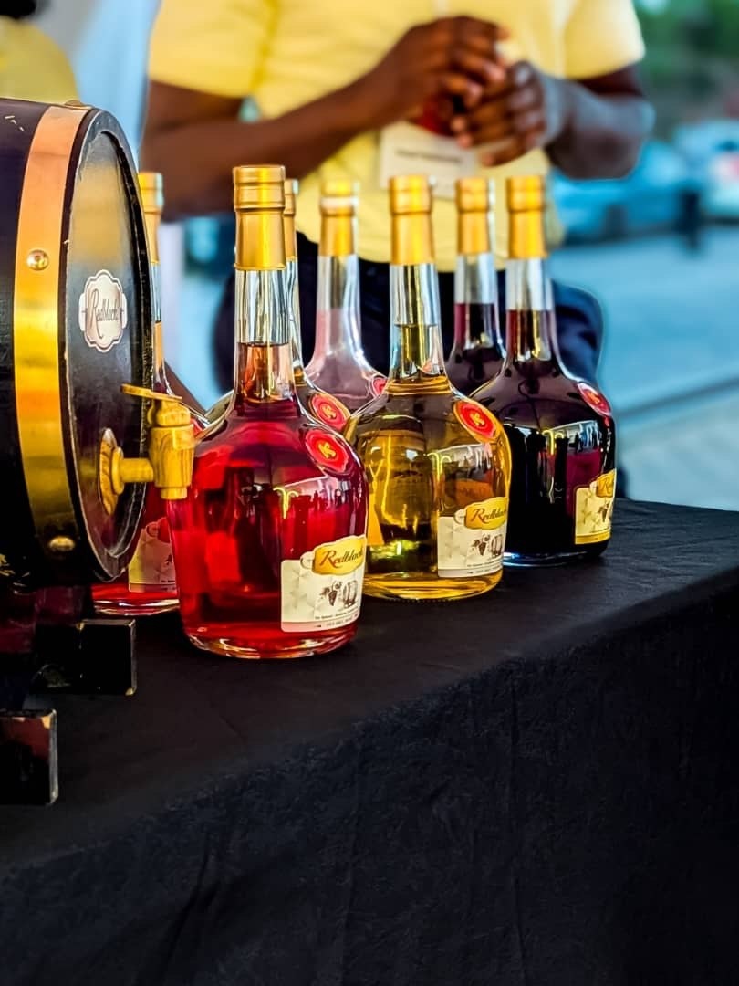 Assortment of Redblack Wines white, red, and rosé bottles displayed at a tasting event in Kigali and Goma, Rwanda