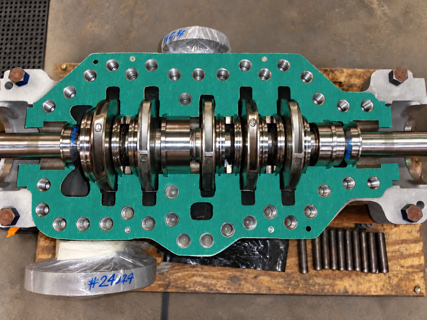 Top-down view of an open rotating assembly with a green housing gasket