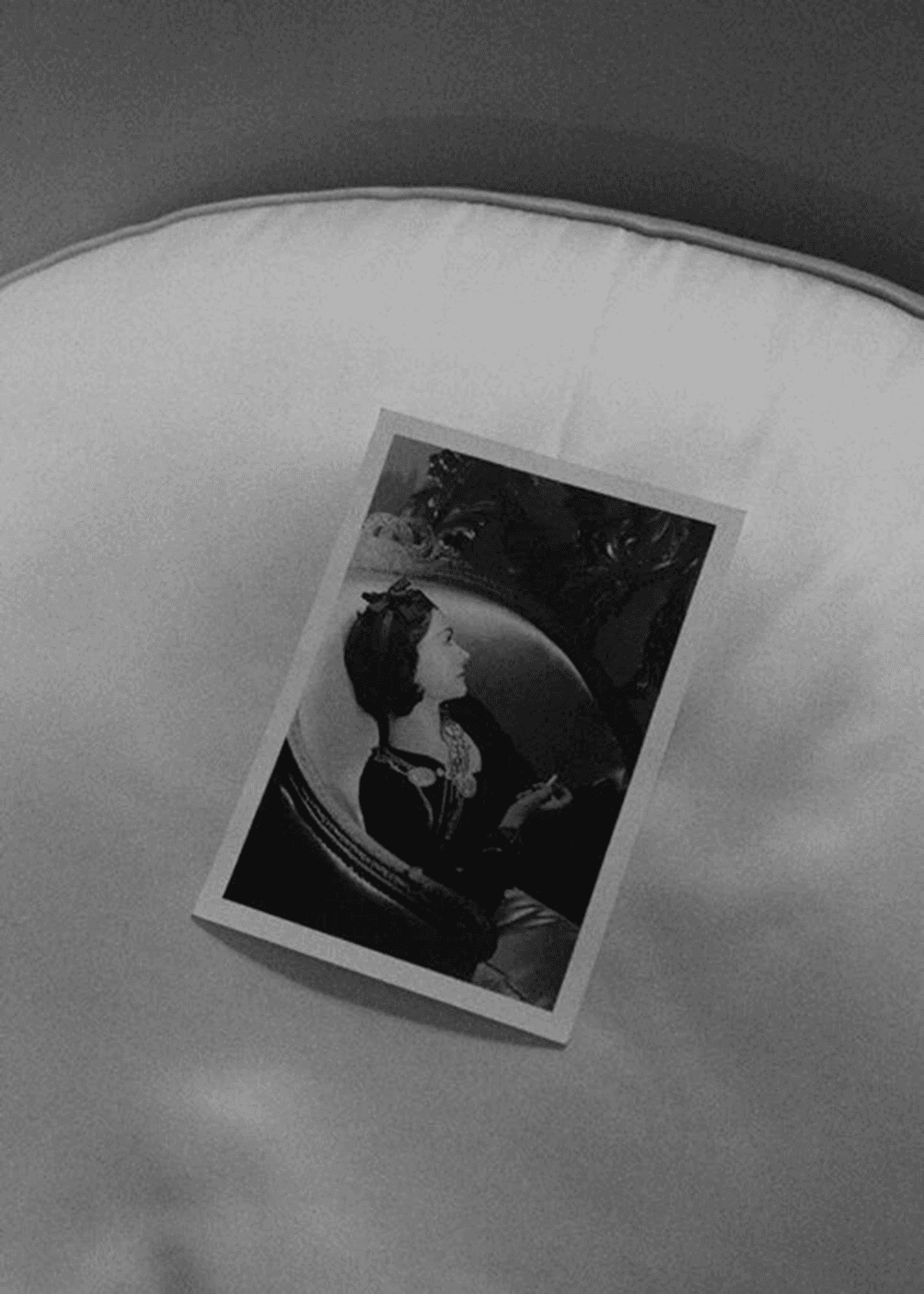 A fast black sports car races down the highway.