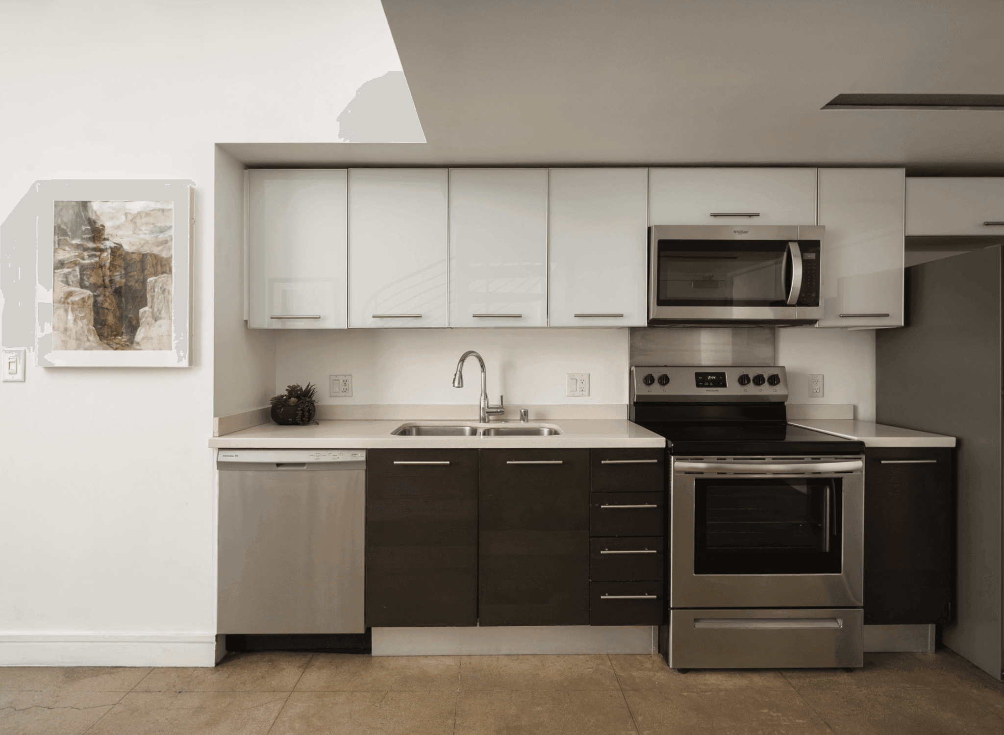 Modern loft kitchen with stainless steel appliances inside The Judson.
