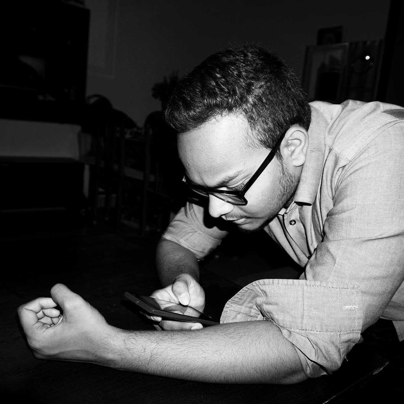 Profile portrait of a man in a grey shirt