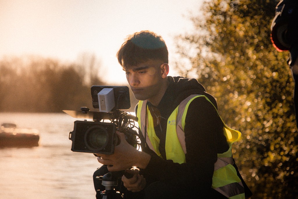 husband and wife working happily on a laptop