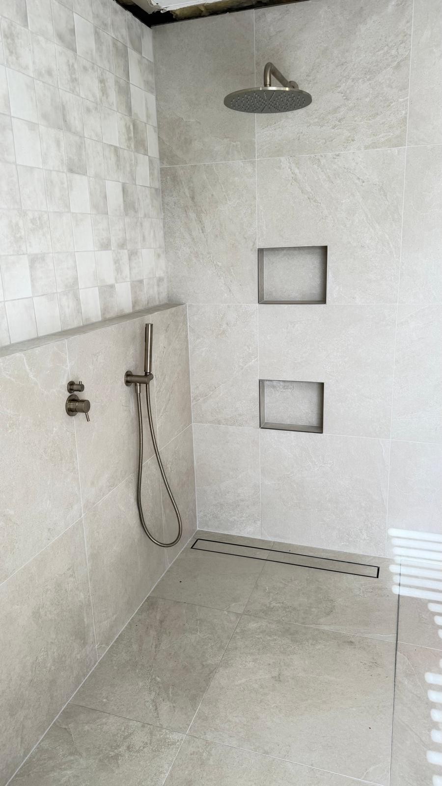 Completed walk-in shower plumbing