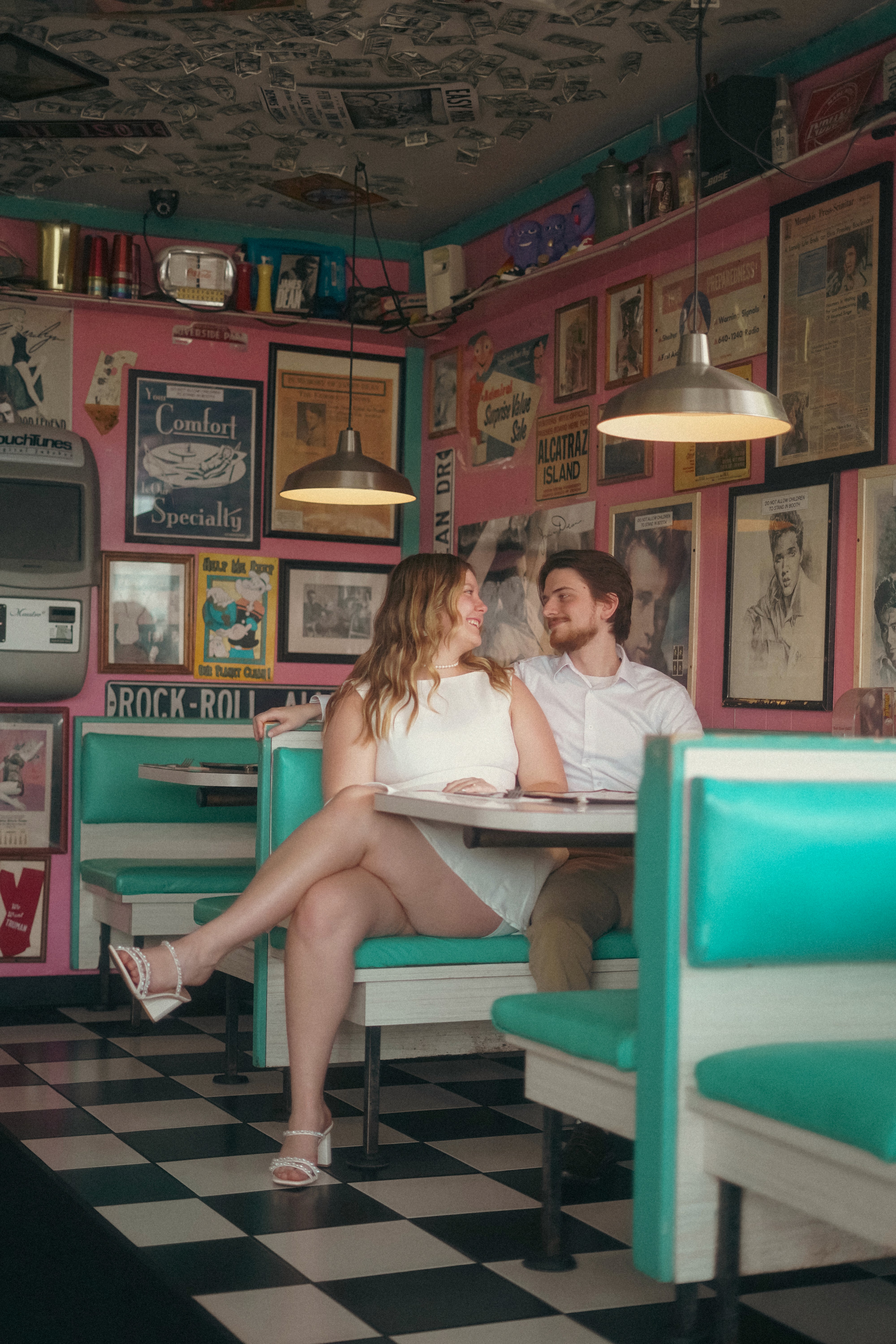 A joyful couple stands together.