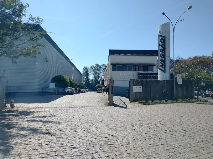Computer screen displaying code and graphs on a desk with a keyboard and mouse.