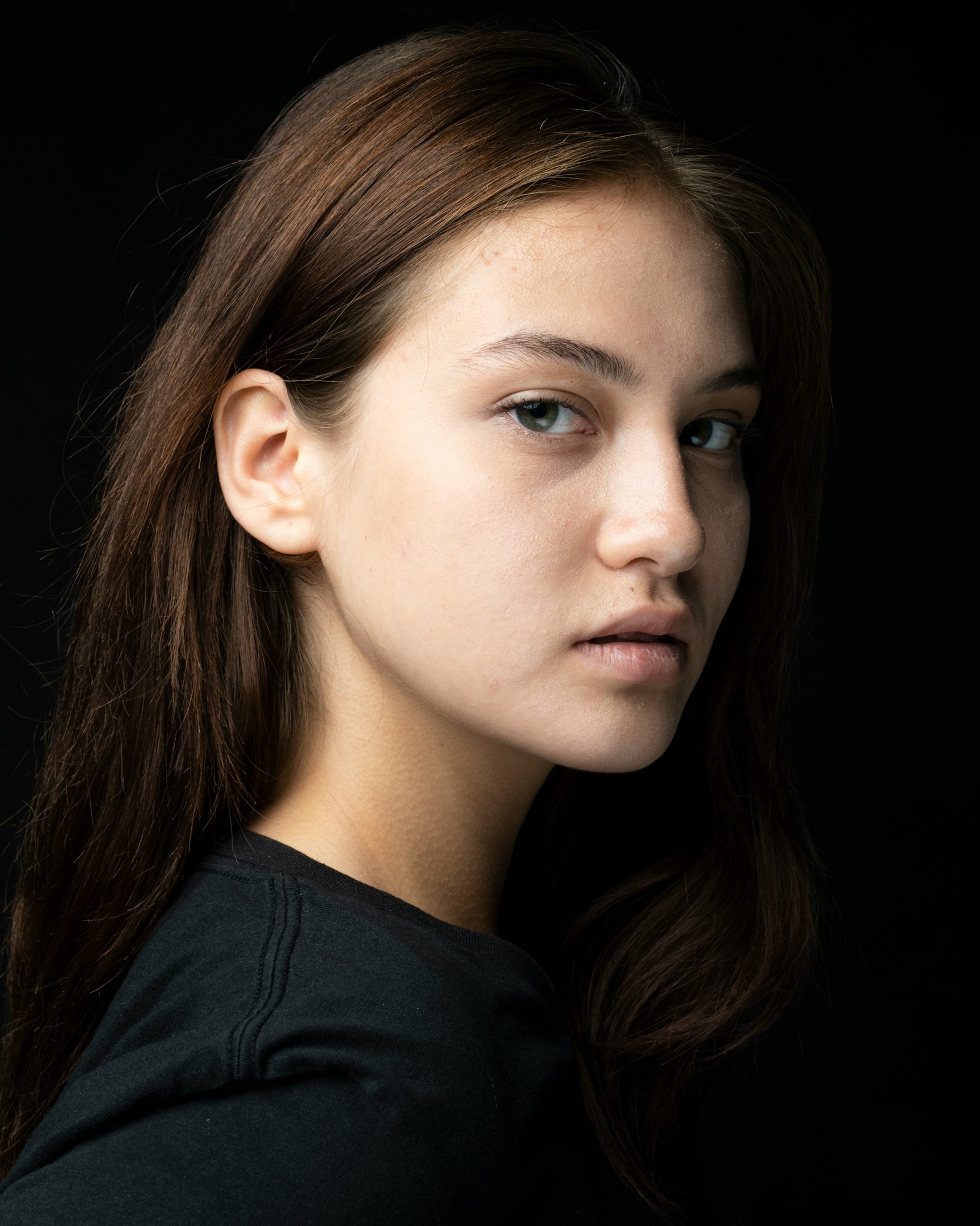 Woman in black crew neck shirt — editorial portraiture image 10 for "Close to the Light"