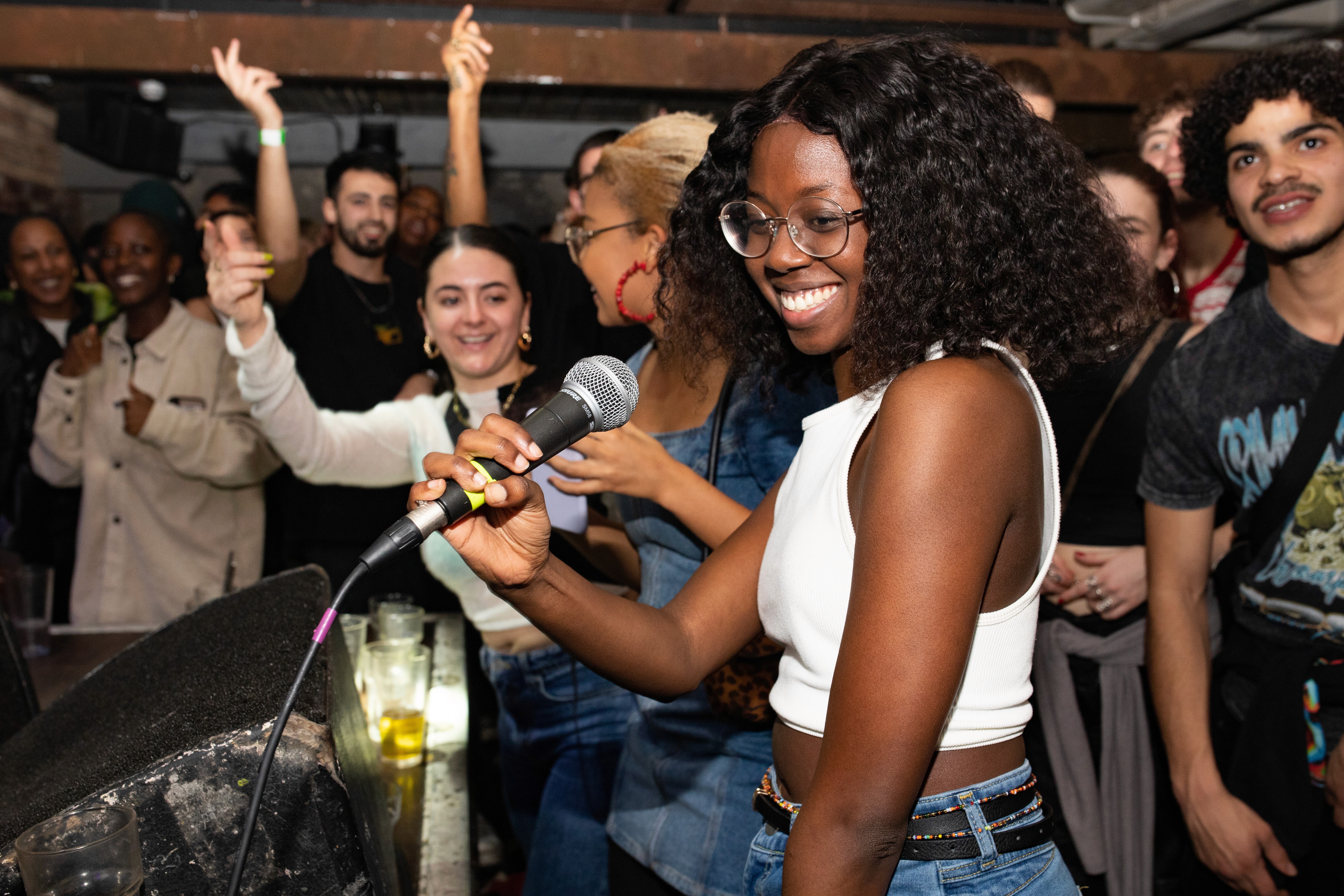 Crowd watching a live performance at a Root 73 event.