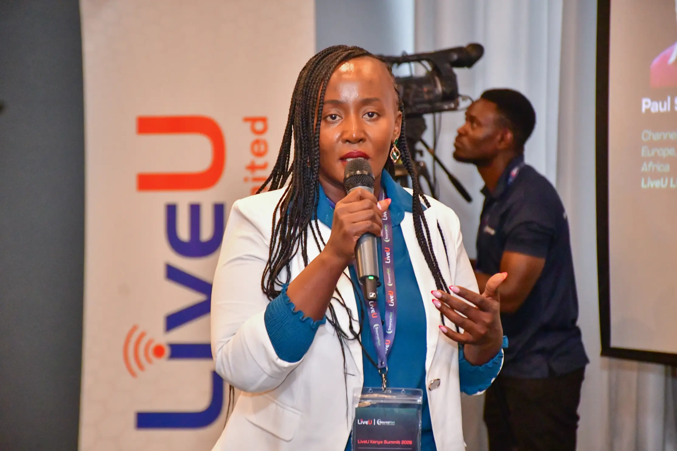 man in gray hoodie and blue denim jeans standing on brown wooden parquet flooring