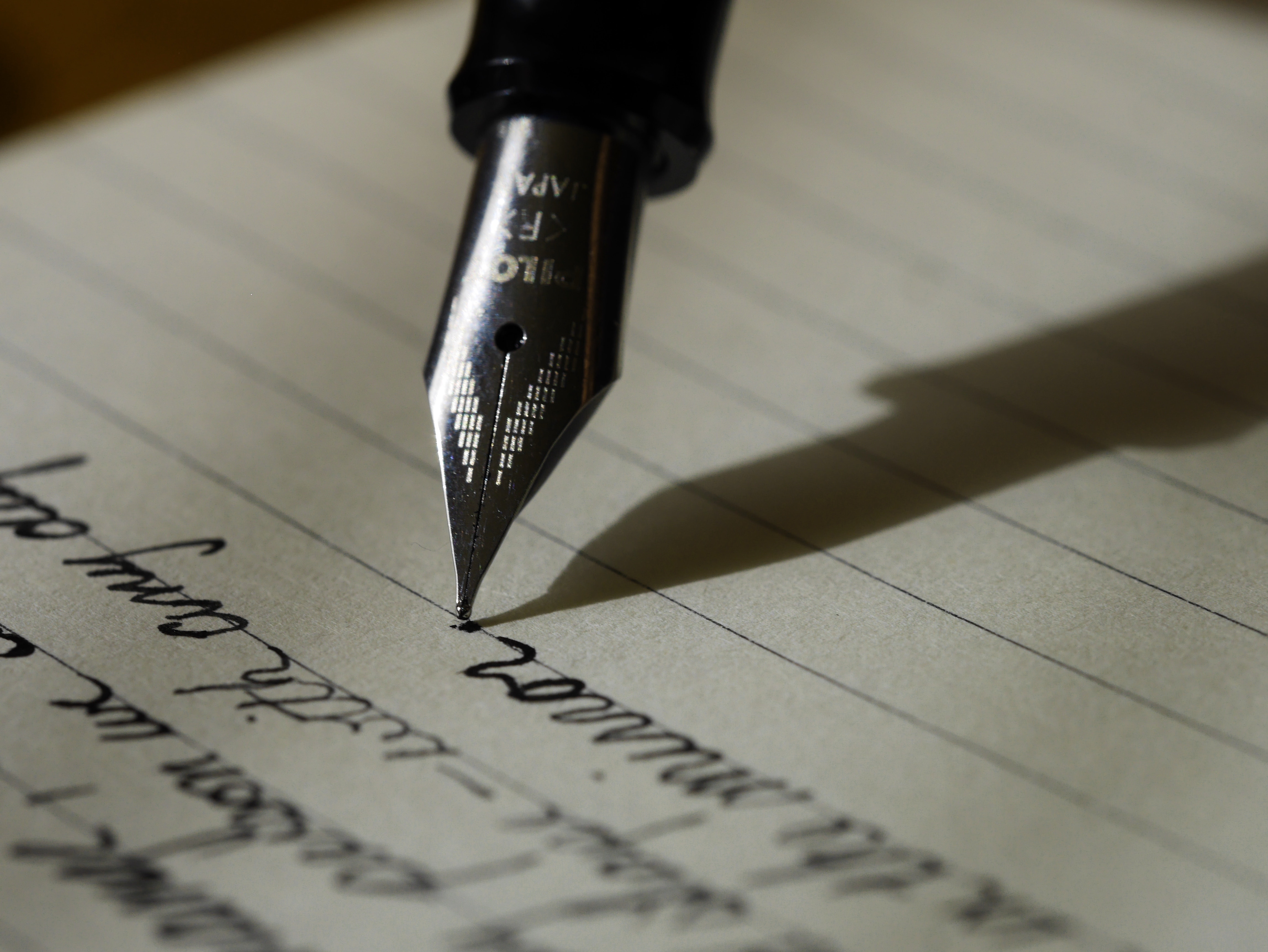 person writing a complete song writing structure