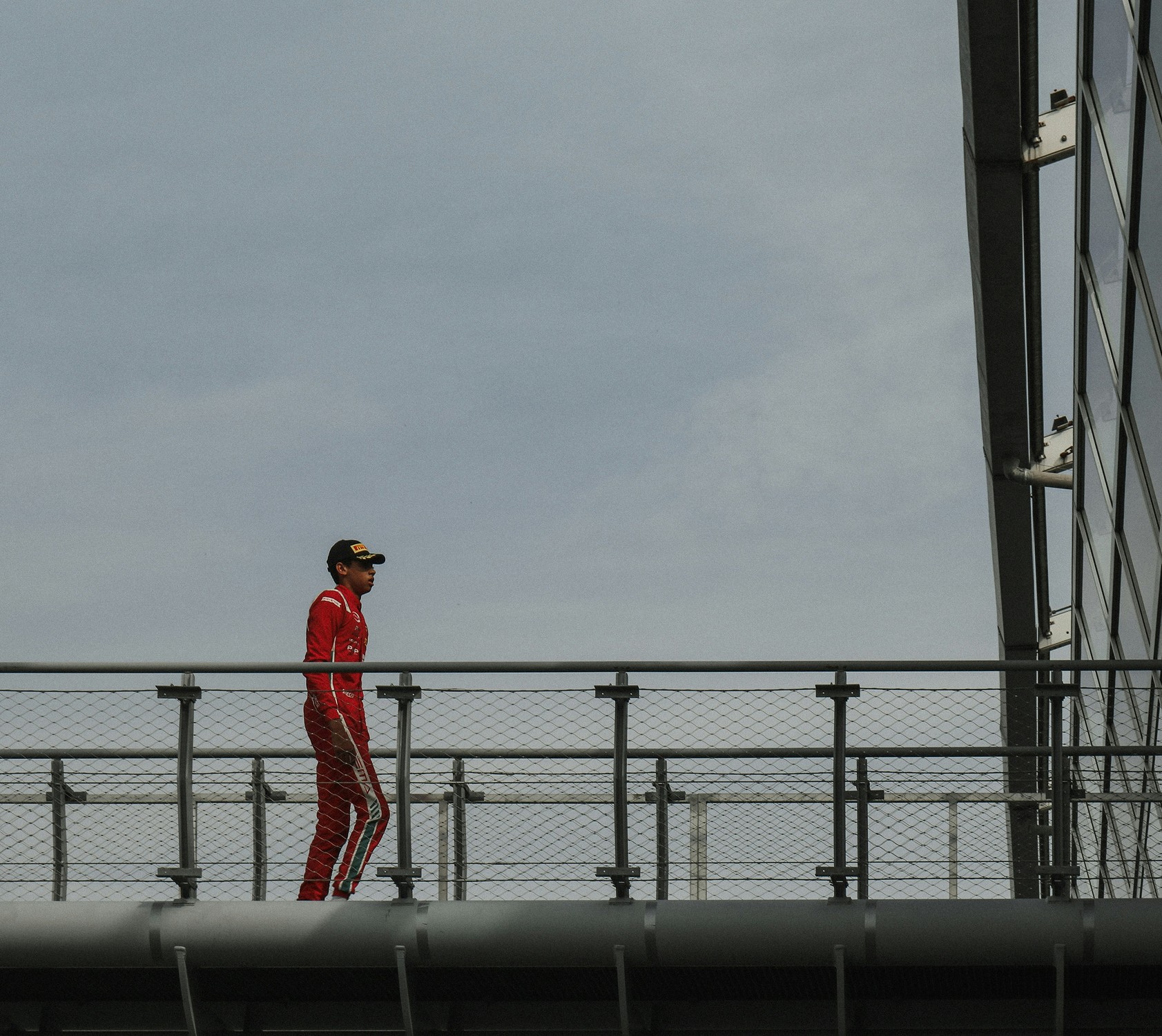 Person standing on rocky coastline.