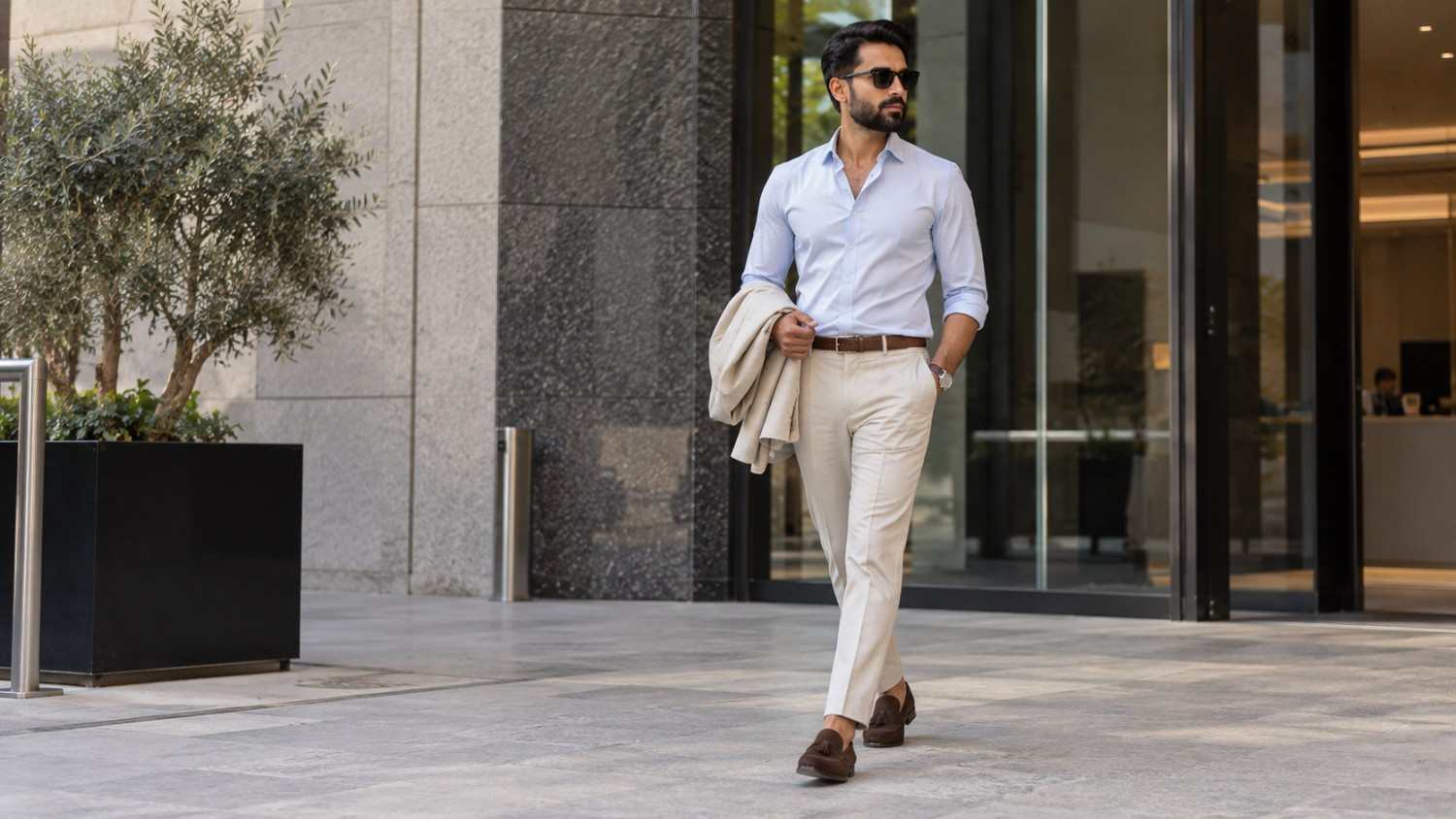 A man walking in Summer outfit in Dubai