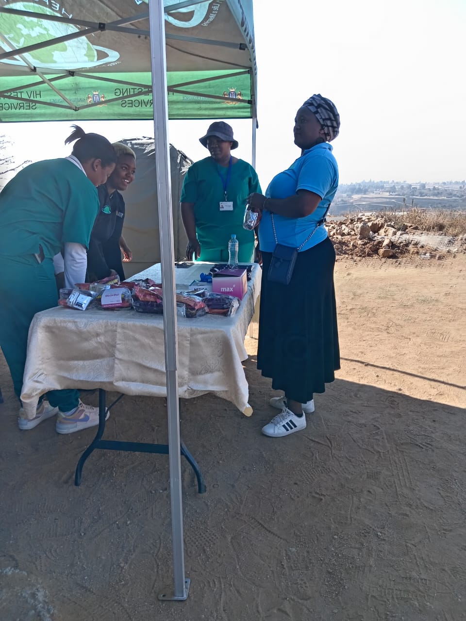 A close-up view of dark green leaves, creating a lush, textured background with subtle variations in color.